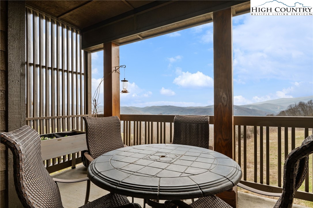 396 Summit View Parkway, Unit S1221 Boone, NC 28607 - Photo 12 of 37 a view of a balcony with a table and chairs