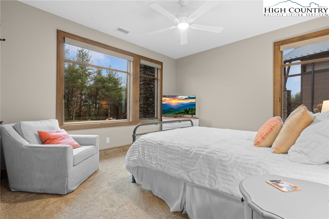 396 Summit View Parkway, Unit S1221 Boone, NC 28607 - Photo 17 of 37 a bedroom with a bed and a couch