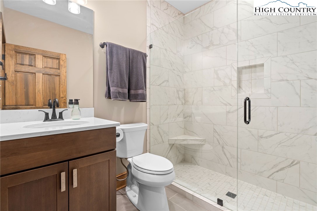 396 Summit View Parkway, Unit S1221 Boone, NC 28607 - Photo 19 of 37 a bathroom with a sink a toilet and shower