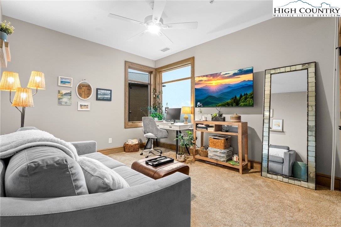 396 Summit View Parkway, Unit S1221 Boone, NC 28607 - Photo 20 of 37 a living room with furniture and a flat screen tv