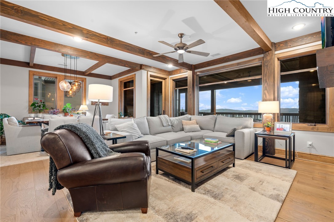 396 Summit View Parkway, Unit S1221 Boone, NC 28607 - Photo 2 of 37 a living room with furniture ceiling fan and a rug