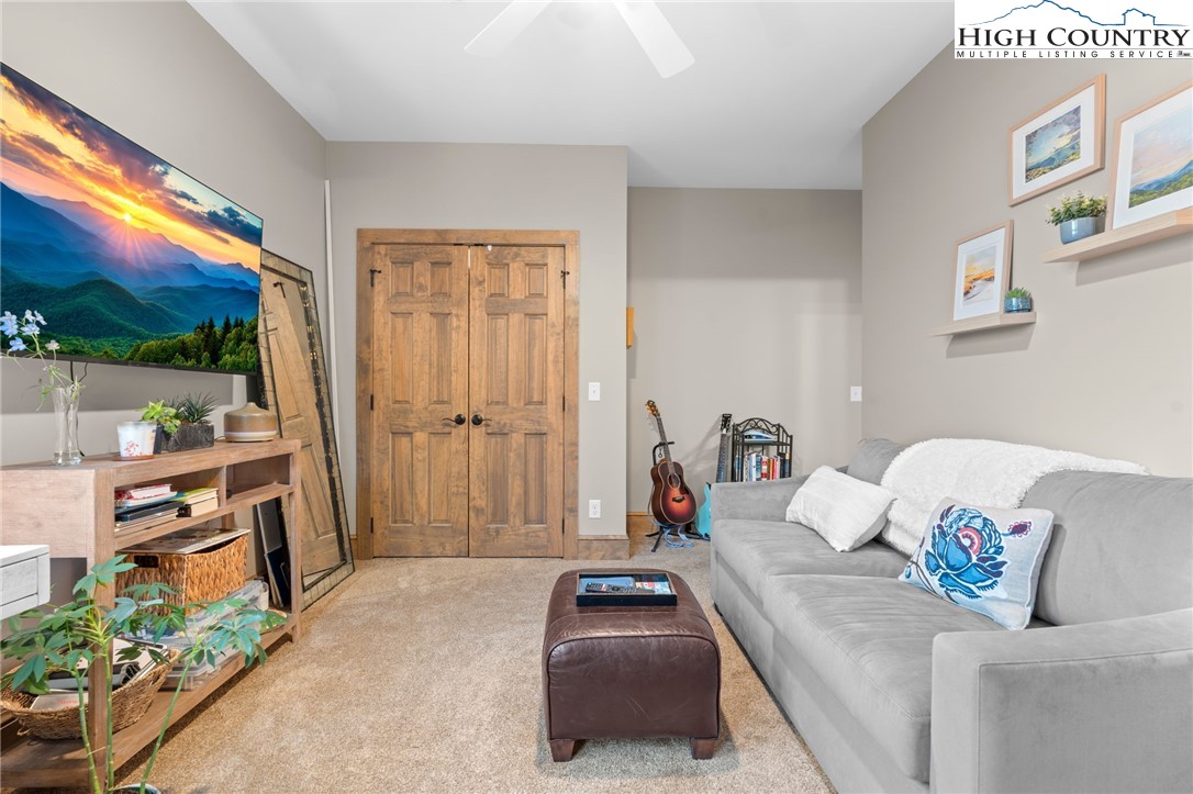 396 Summit View Parkway, Unit S1221 Boone, NC 28607 - Photo 21 of 37 a bedroom with a bed and a flat tv screen