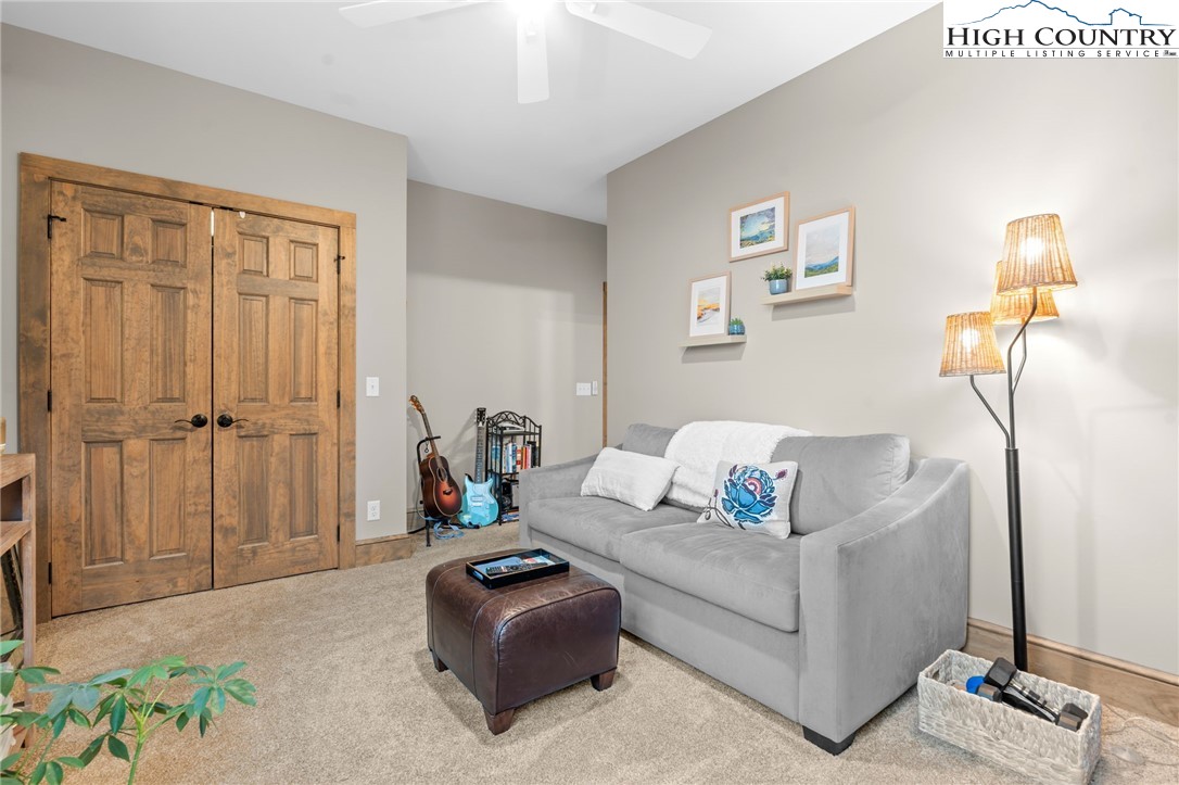396 Summit View Parkway, Unit S1221 Boone, NC 28607 - Photo 22 of 37 a living room with furniture and a lamp