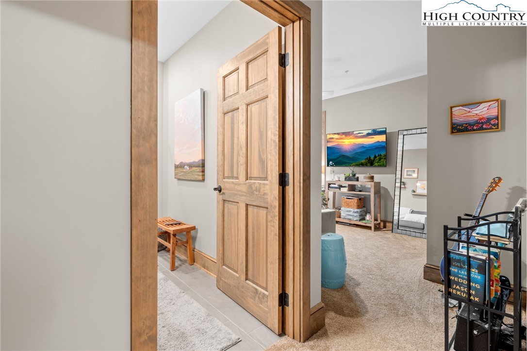 396 Summit View Parkway, Unit S1221 Boone, NC 28607 - Photo 24 of 37 a view of a livingroom with furniture and a flat screen tv