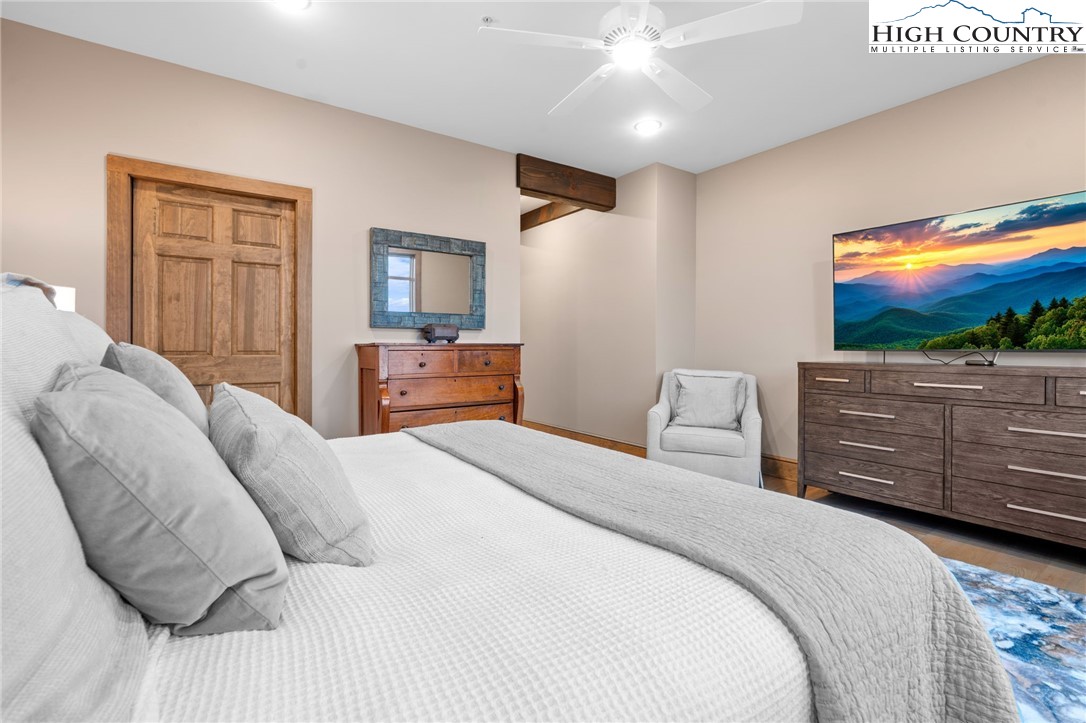 396 Summit View Parkway, Unit S1221 Boone, NC 28607 - Photo 27 of 37 a bedroom with a bed and a flat screen tv