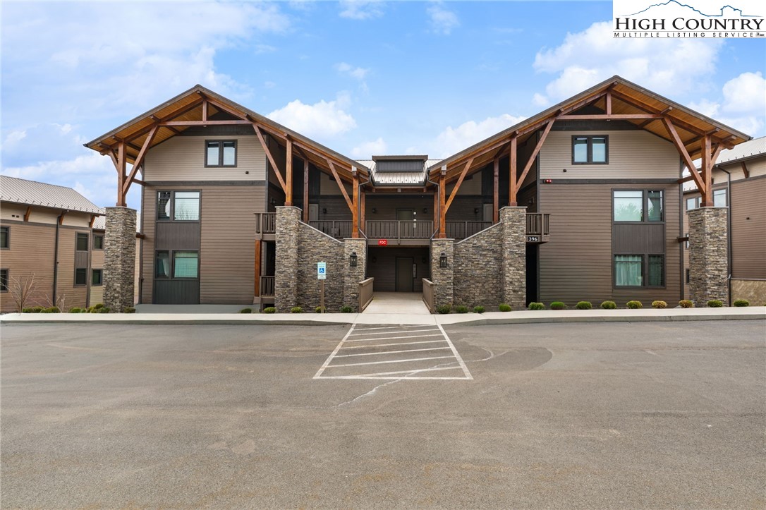 396 Summit View Parkway, Unit S1221 Boone, NC 28607 - Photo 29 of 37 a front view of a house with a yard