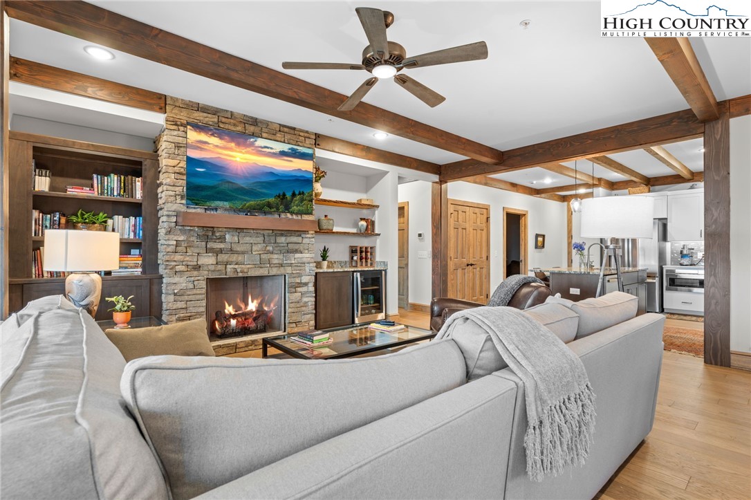 396 Summit View Parkway, Unit S1221 Boone, NC 28607 - Photo 3 of 37 a living room with furniture a fireplace and a flat screen tv