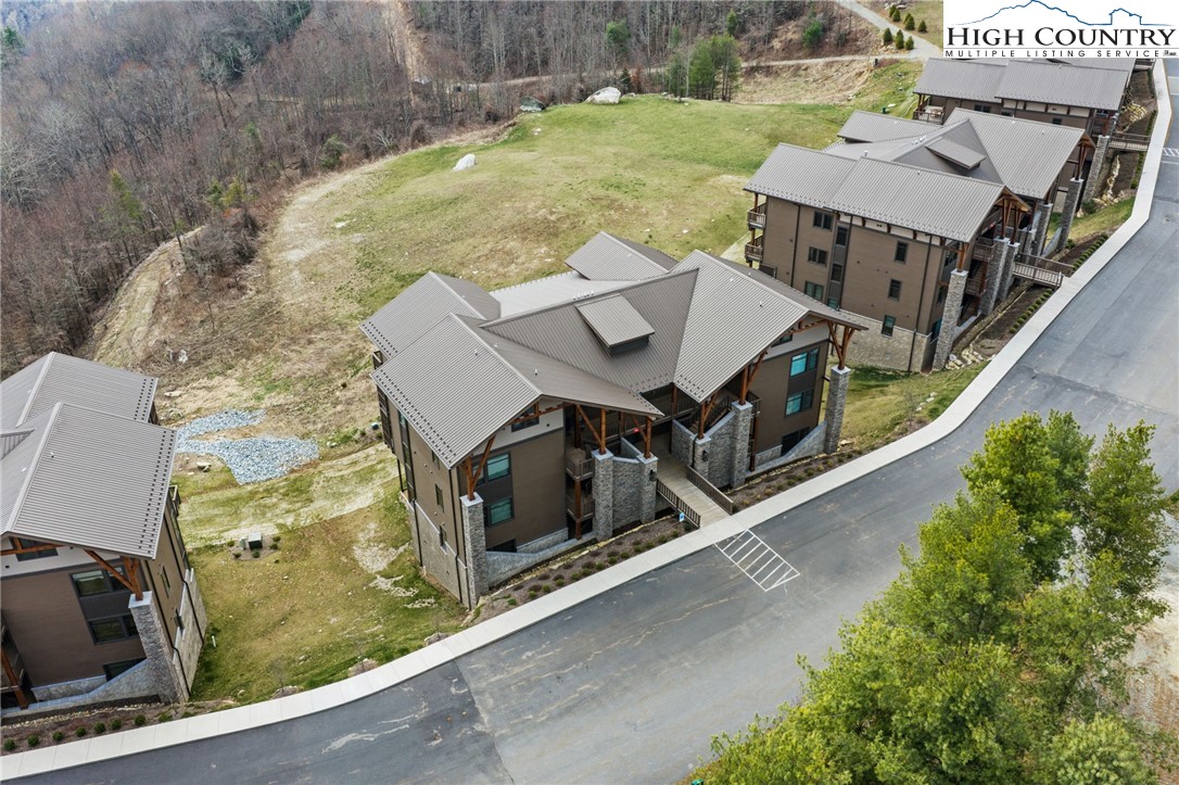 396 Summit View Parkway, Unit S1221 Boone, NC 28607 - Photo 31 of 37 an aerial view of a house with a yard