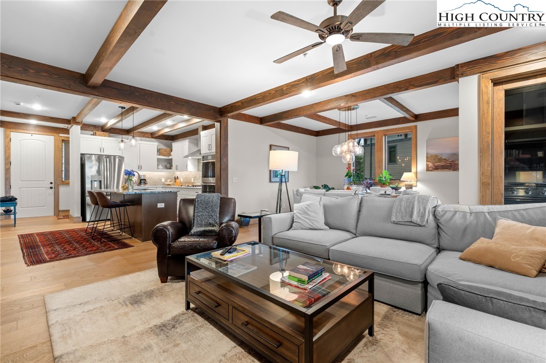 396 Summit View Parkway, Unit S1221 Boone, NC 28607 - Photo 4 of 37 a living room with furniture a ceiling fan and a rug