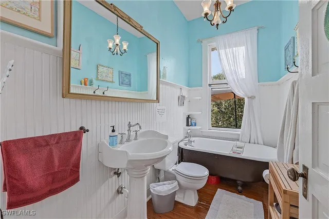 a bathroom with a sink a toilet and a bathtub