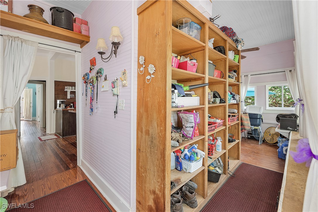 13841-13845 Robert Road Bokeelia, FL 33922 - Photo 23 of 50 a view of a room with lots of stuff and hardwood floor