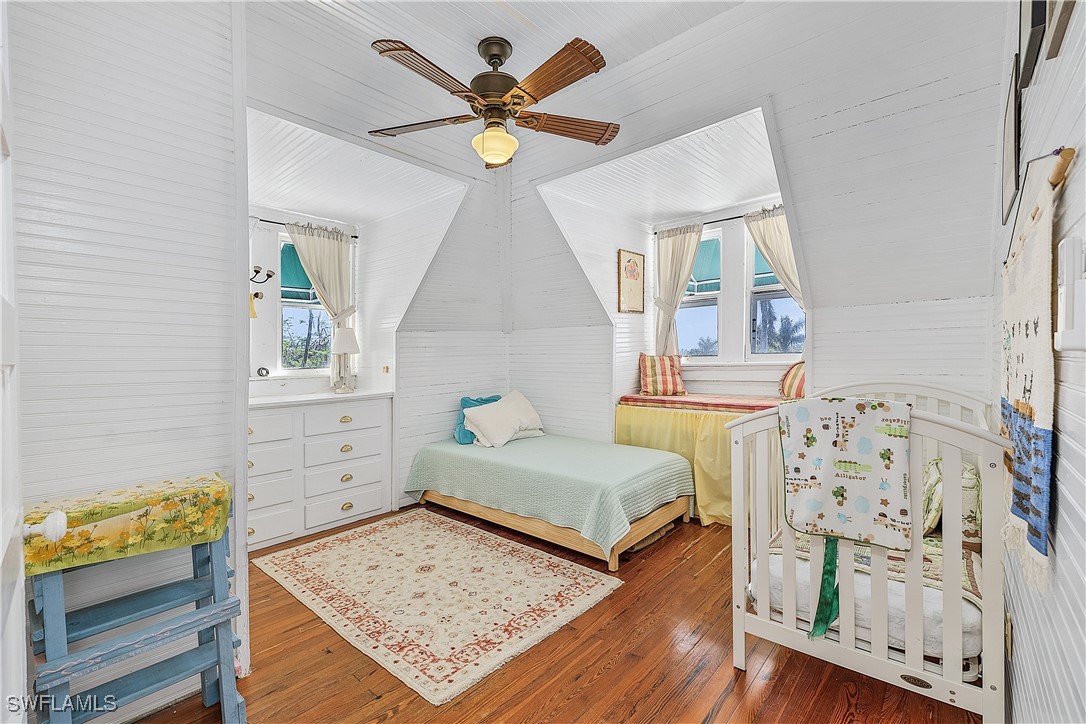 13841-13845 Robert Road Bokeelia, FL 33922 - Photo 25 of 50 a bedroom with a bed and a dresser