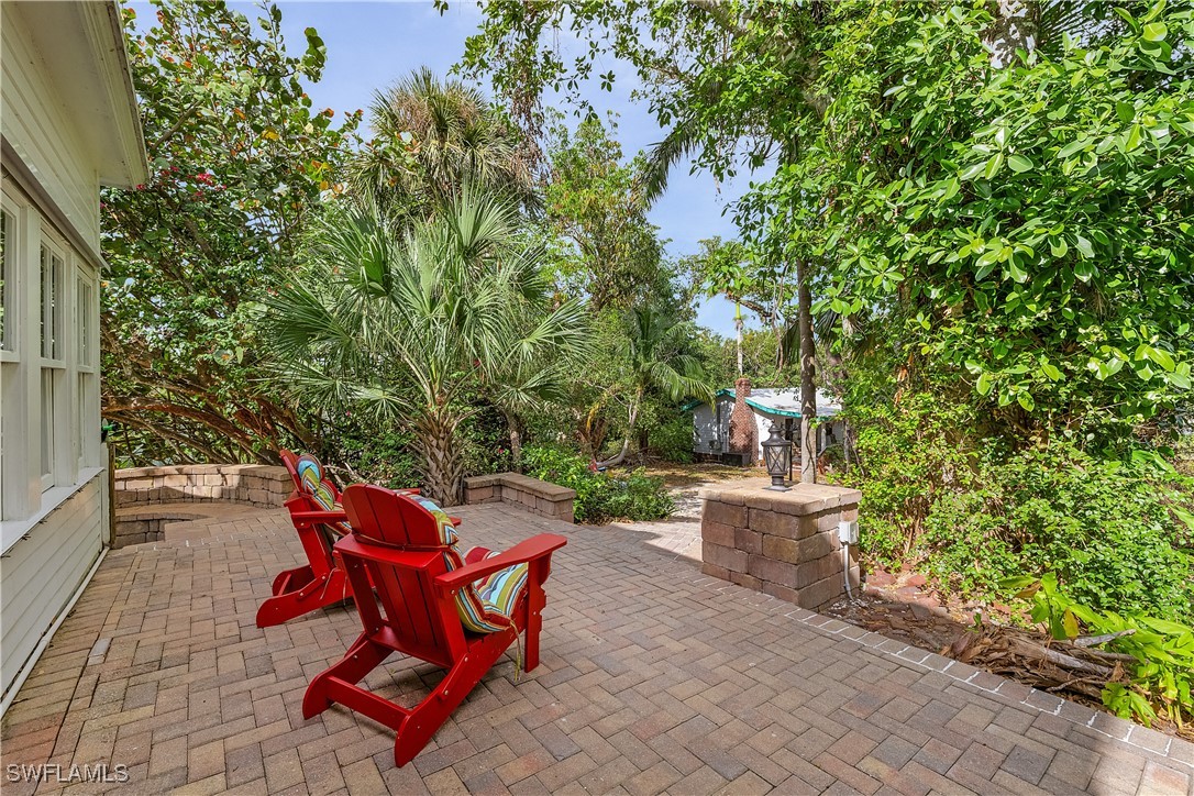 13841-13845 Robert Road Bokeelia, FL 33922 - Photo 28 of 50 a view of a backyard with sitting area