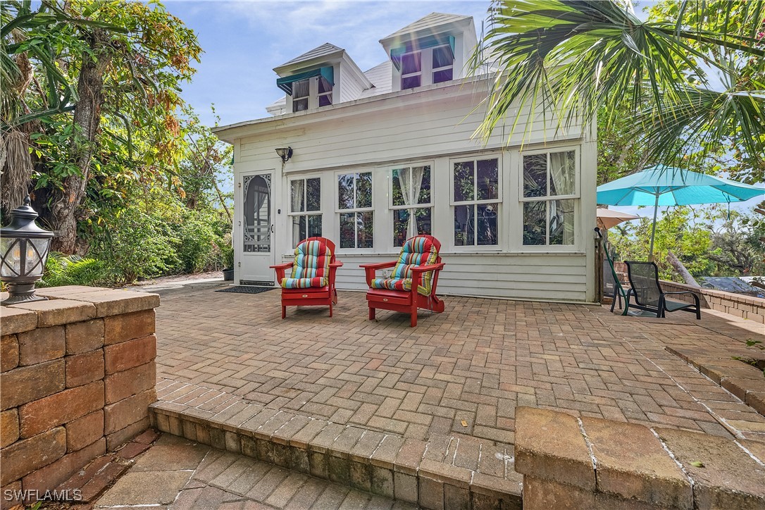 13841-13845 Robert Road Bokeelia, FL 33922 - Photo 3 of 50 a view of a house with a patio