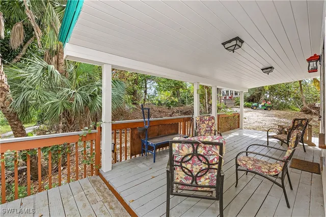 a view of a two chairs in the balcony