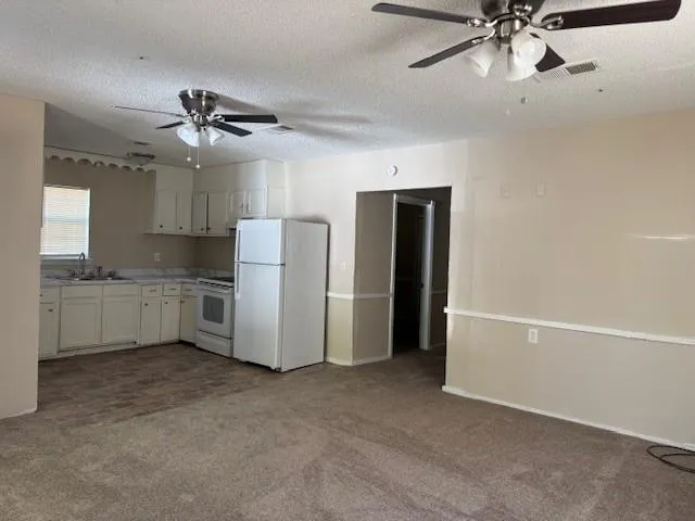 a view of a kitchen with a sink and dishwasher kitchen appliances