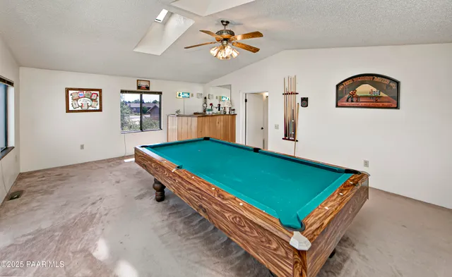 a room with pool table and table