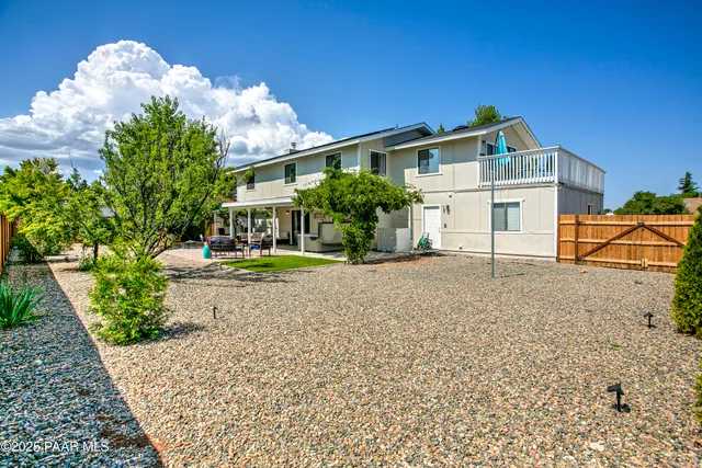 a house view with a seating space and garden view