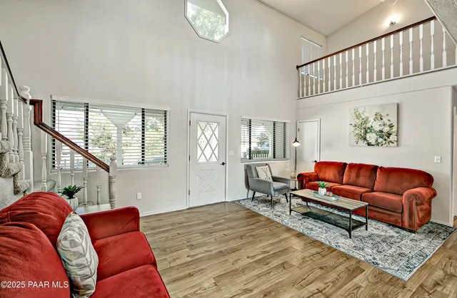 a living room with furniture and a rug