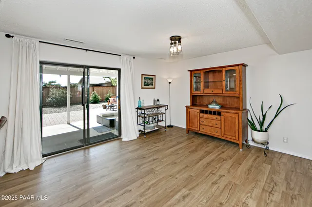 a view of a livingroom with furniture and an empty room