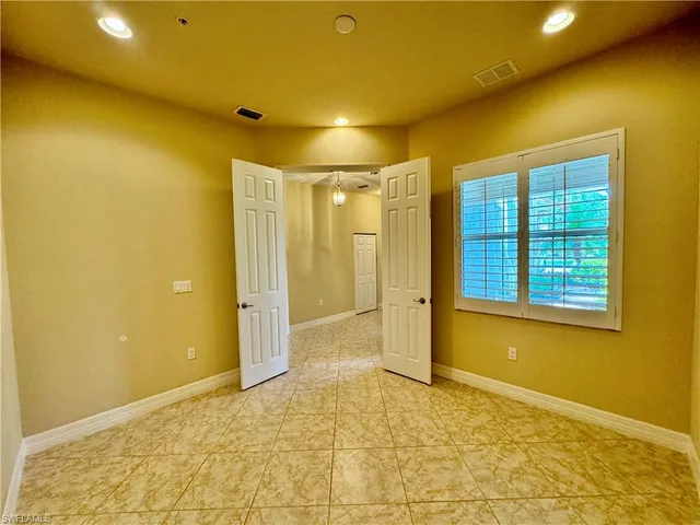 a view of a balcony with wooden floor
