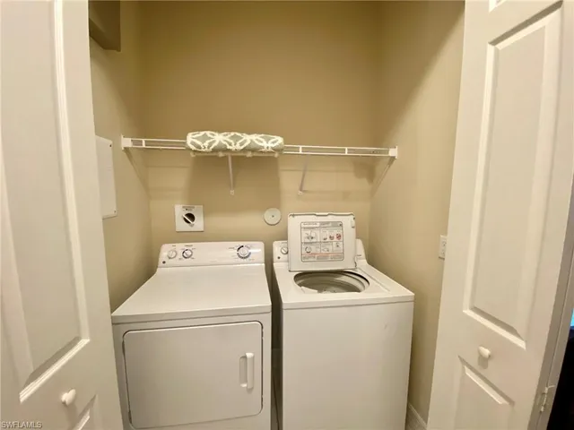 a view of a small house with wooden floor and outdoor space