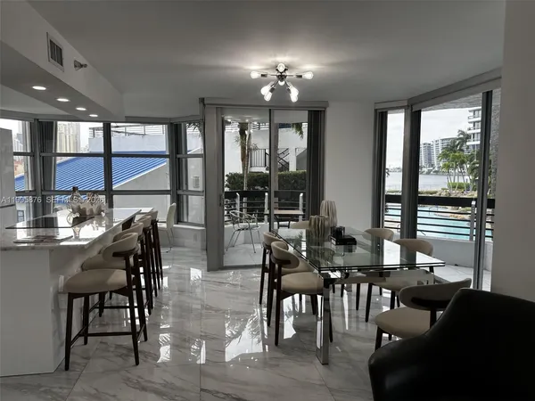 a view of a dining room with furniture window and outside view