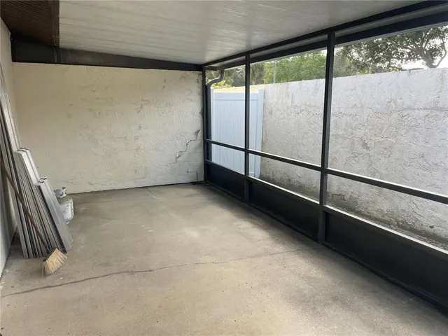 a view of an empty room with a balcony