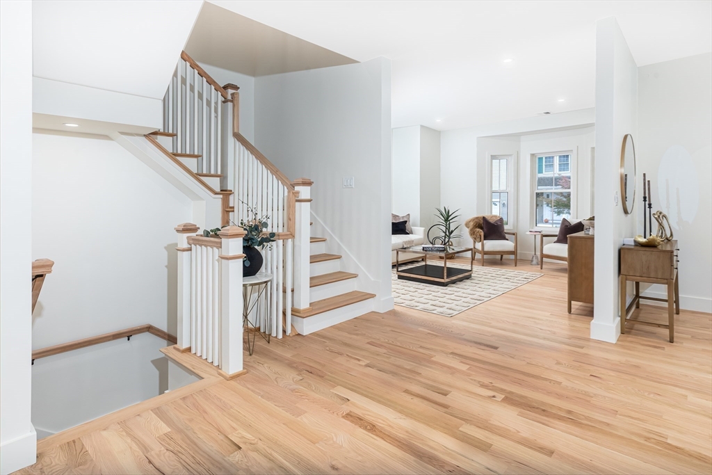 96 Burpee Road, Unit 1 Swampscott, MA 01907 - Photo 13 of 17 a view of a livingroom with wooden floor and furniture