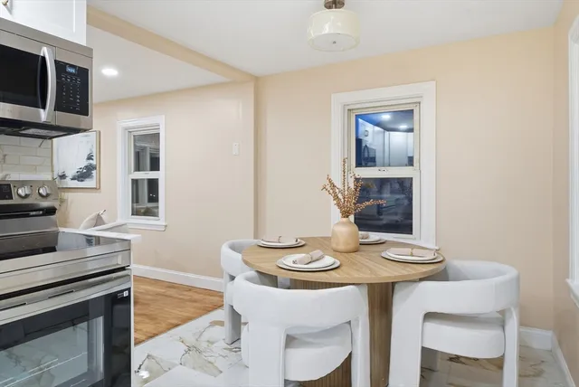 a kitchen with a table and chairs in it