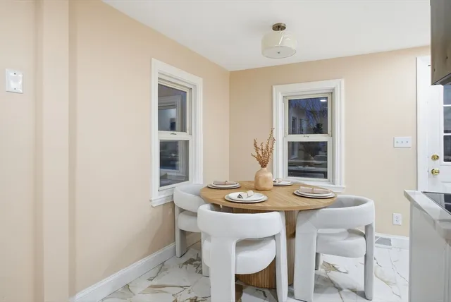 a table and a window in a room