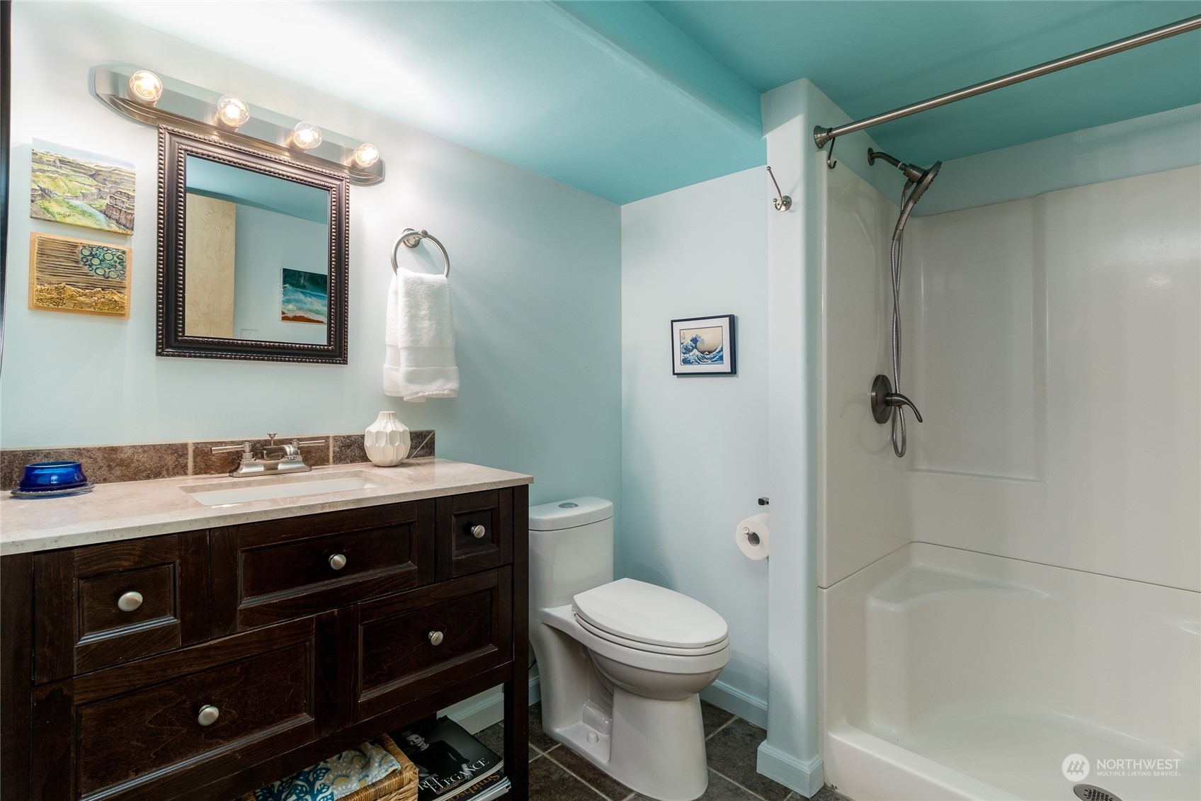 1739 Center Street Walla Walla, WA 99362 - Photo 31 of 40 a bathroom with a toilet a sink a mirror a shower and vanity