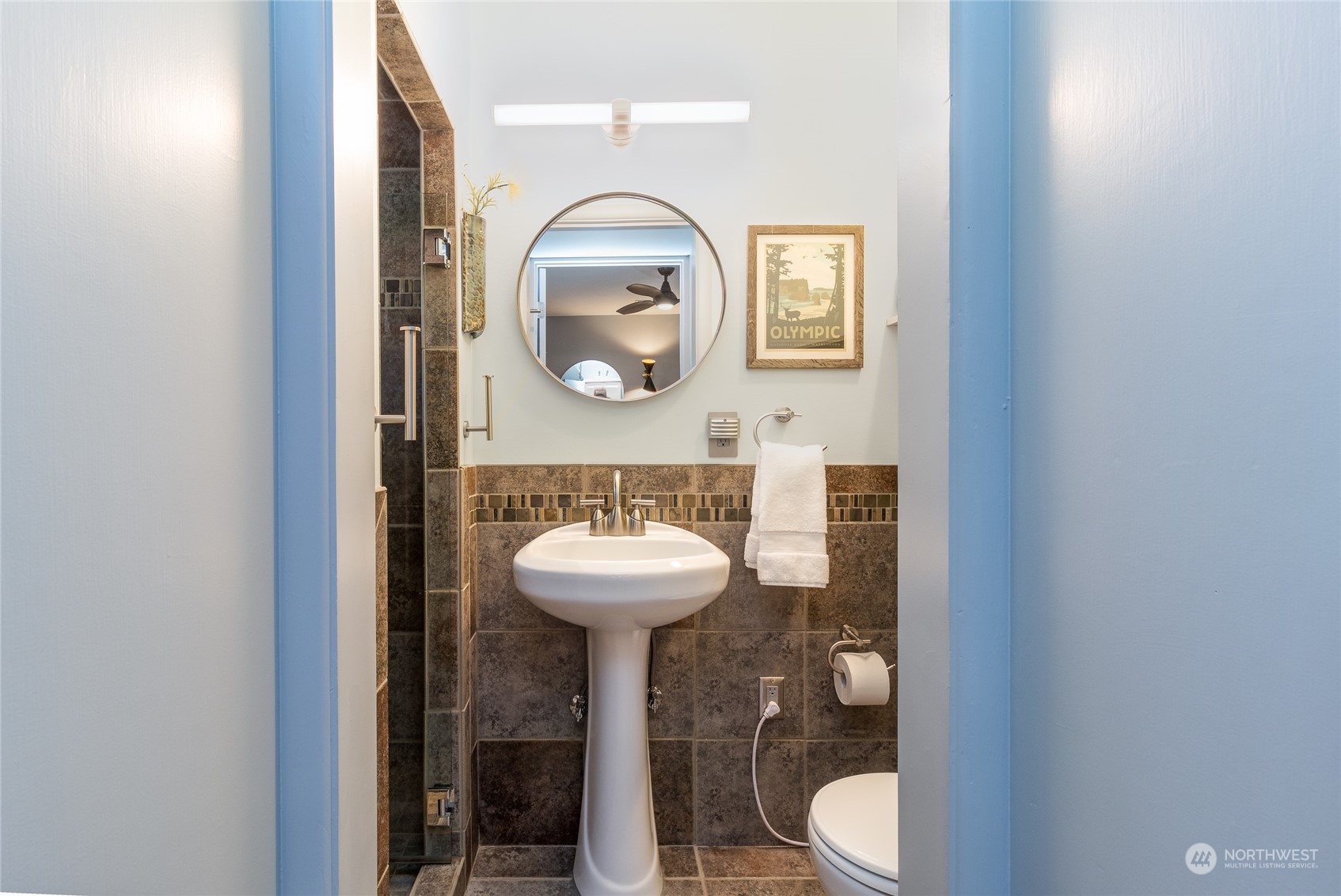 1739 Center Street Walla Walla, WA 99362 - Photo 10 of 40 a bathroom with a toilet sink and mirror