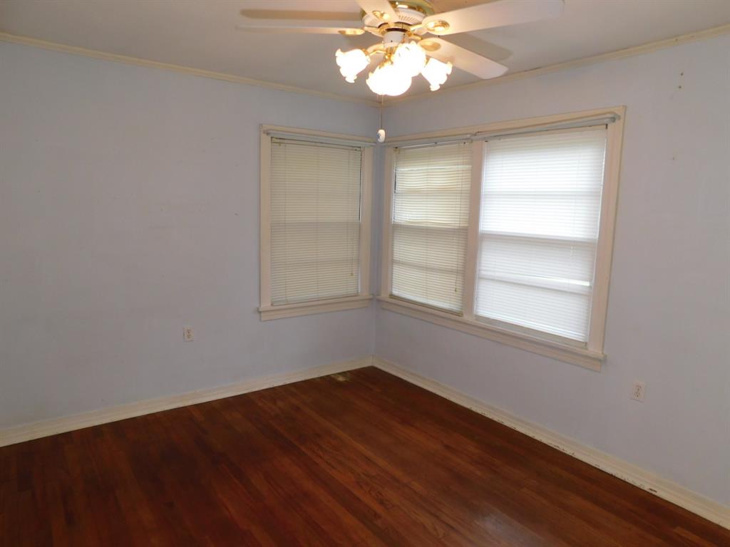 24044 Highway 157 Springhill, LA 71075 - Photo 36 of 40 wooden floor in an empty room with a window