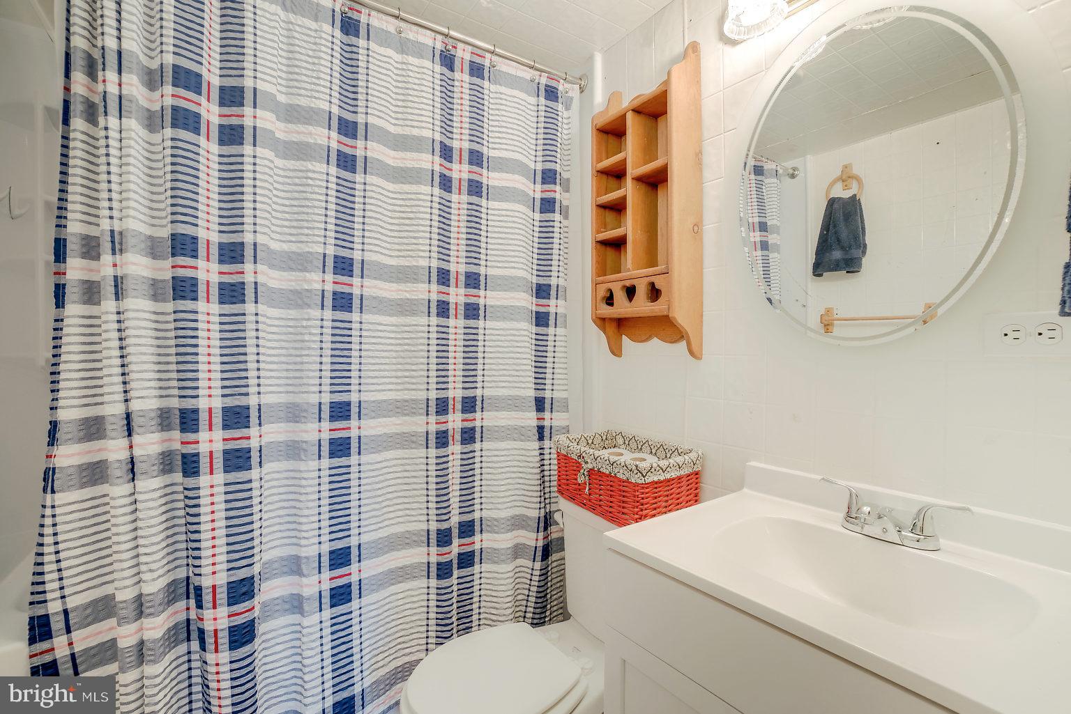 7708 Fairgreen Road Baltimore, MD 21222 - Photo 15 of 44 a bathroom with a sink toilet and shower