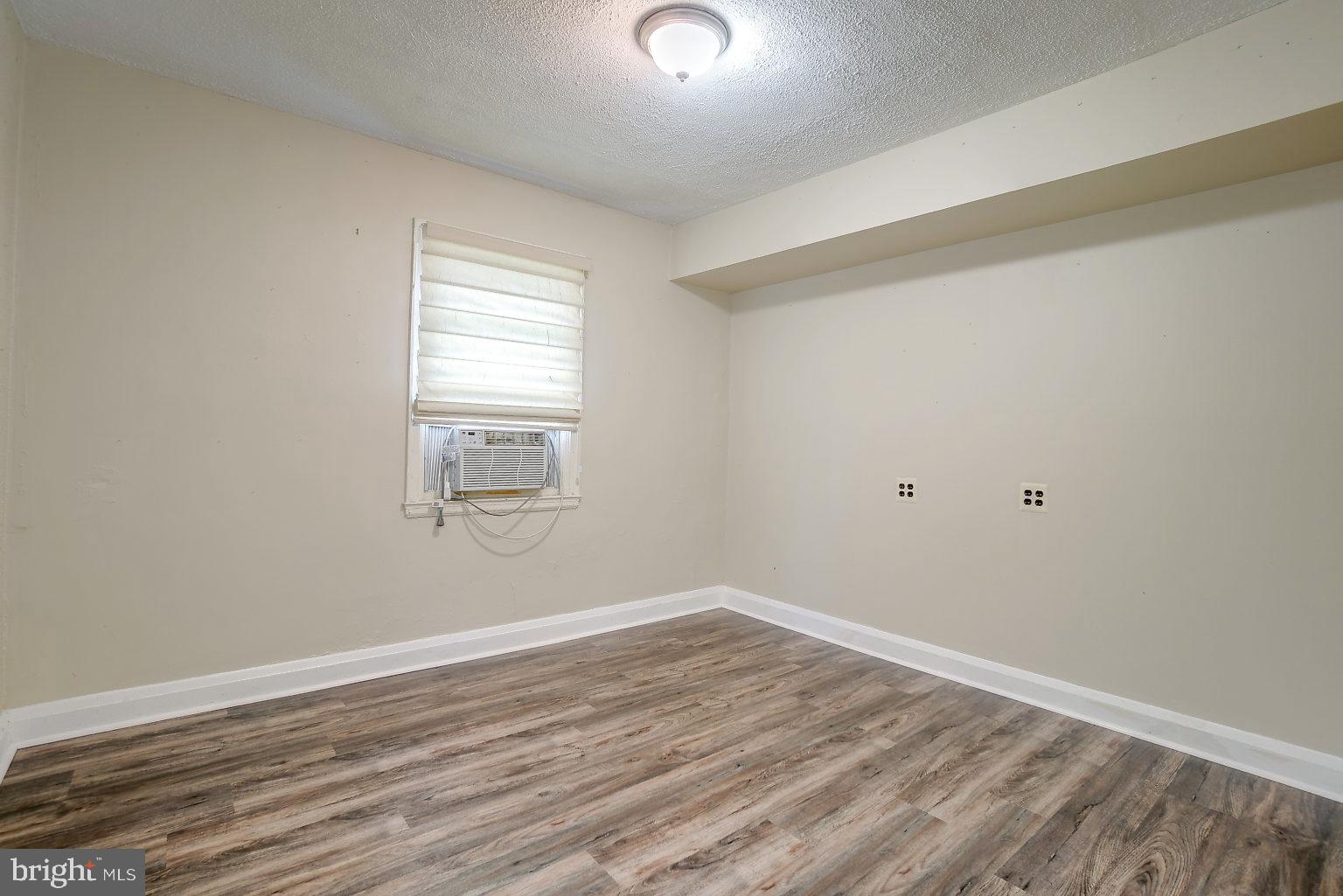 7708 Fairgreen Road Baltimore, MD 21222 - Photo 16 of 44 wooden floor in an empty room