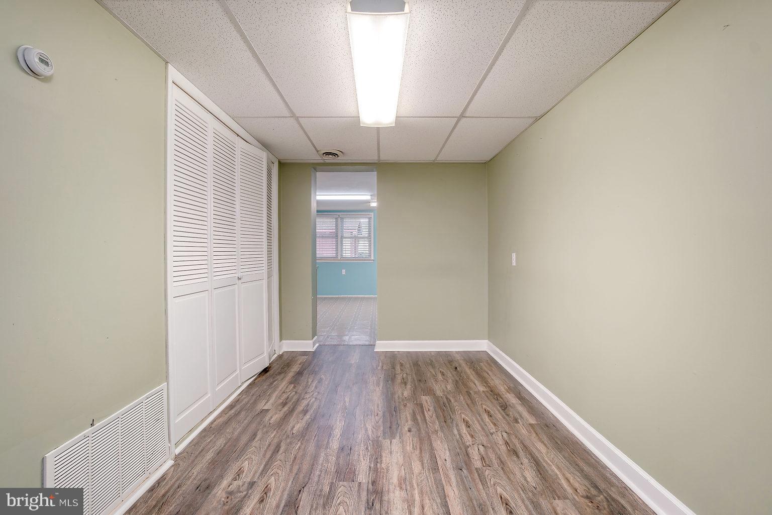 7708 Fairgreen Road Baltimore, MD 21222 - Photo 20 of 44 a view of a room with wooden floor