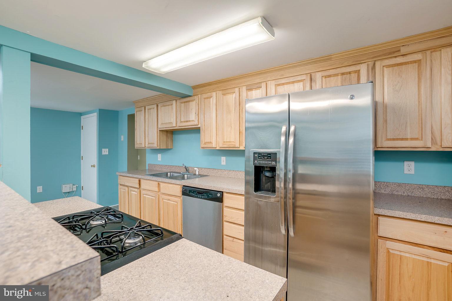 7708 Fairgreen Road Baltimore, MD 21222 - Photo 32 of 44 a kitchen with stainless steel appliances granite countertop a refrigerator and a stove top oven