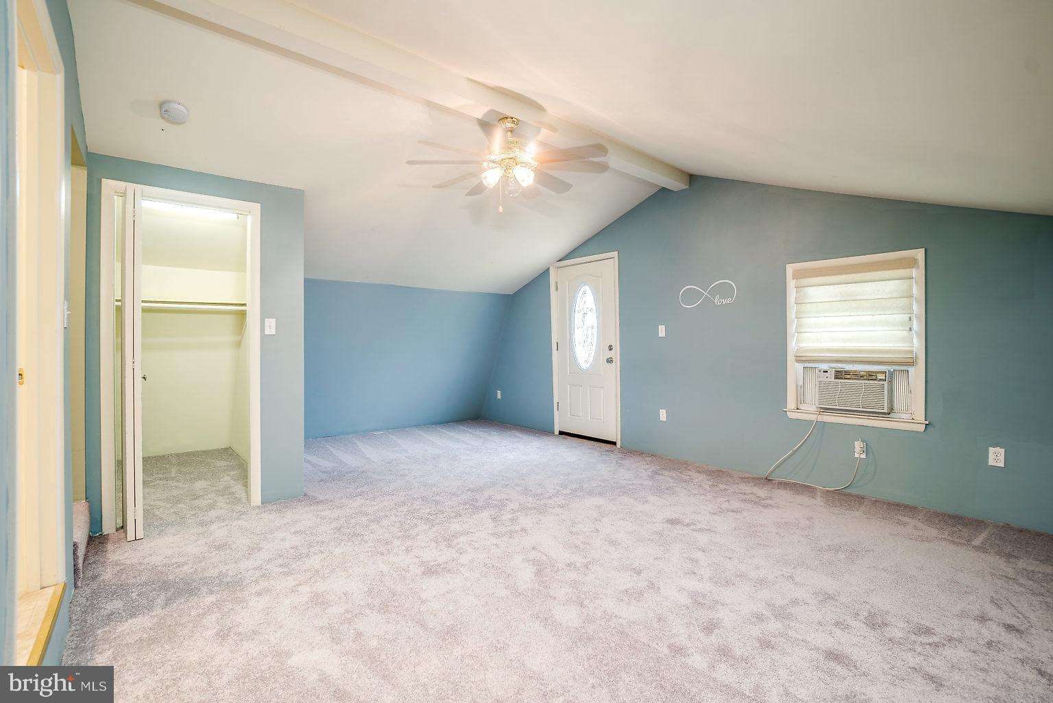 7708 Fairgreen Road Baltimore, MD 21222 - Photo 40 of 44 an empty room with windows and closet area