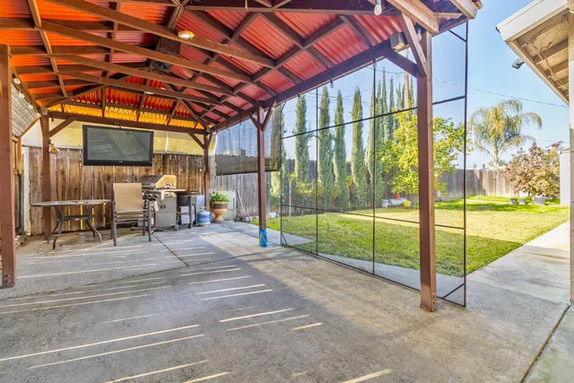 a view of a backyard with potted plants