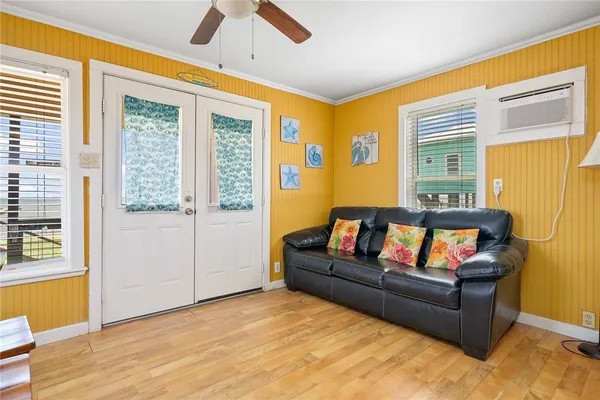 a living room with furniture and a window