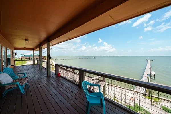 a view of a balcony with wooden floor