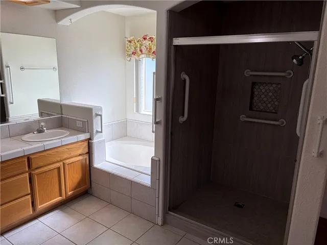 a bathroom with a bathtub and a sink