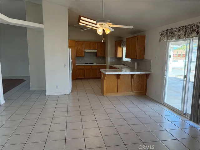 a view of a kitchen with a sink and dishwasher in kitchen with a window