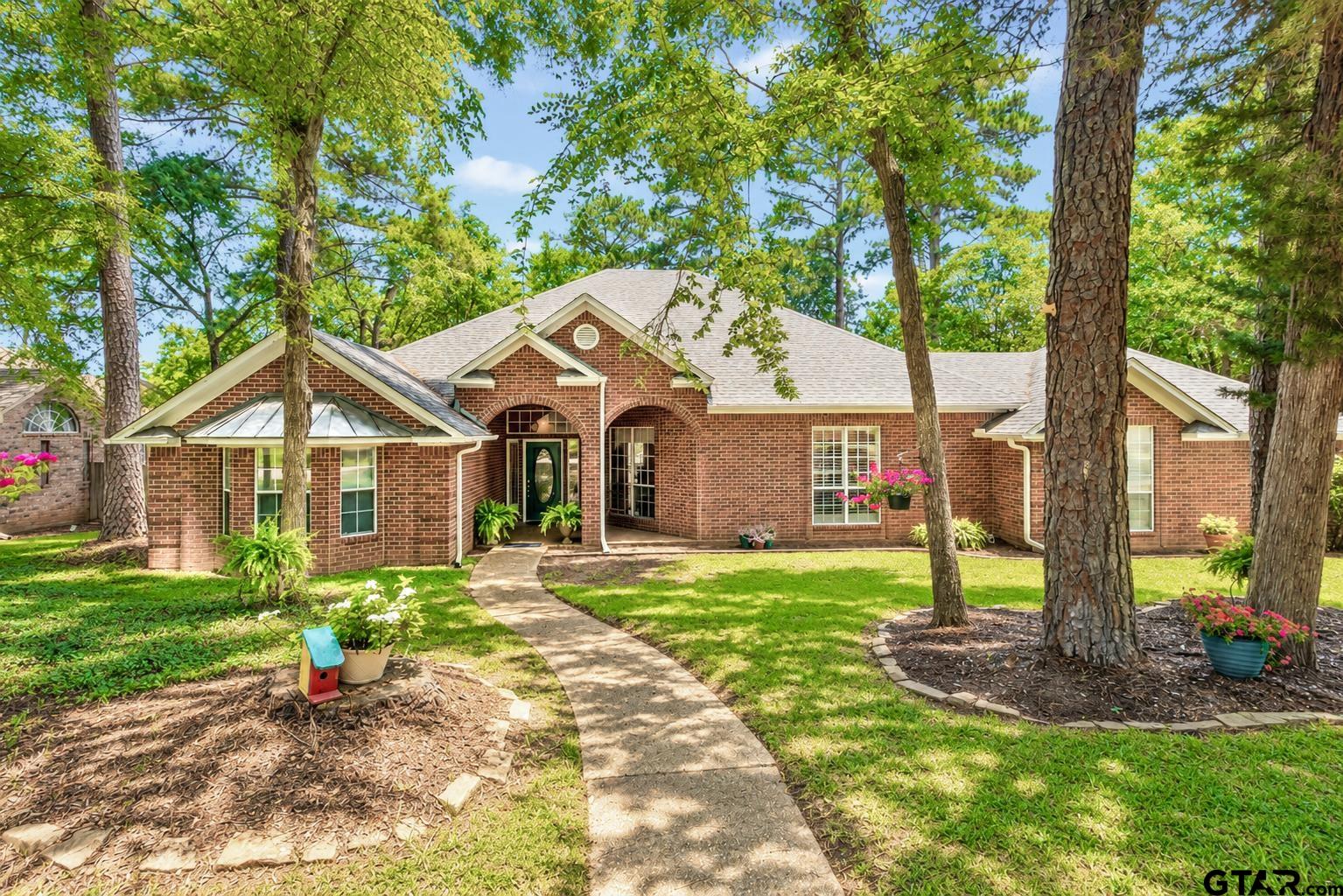 1388 Santa Fe Trail Tyler, TX 75703 - Photo 2 of 46 a front view of a house with a yard