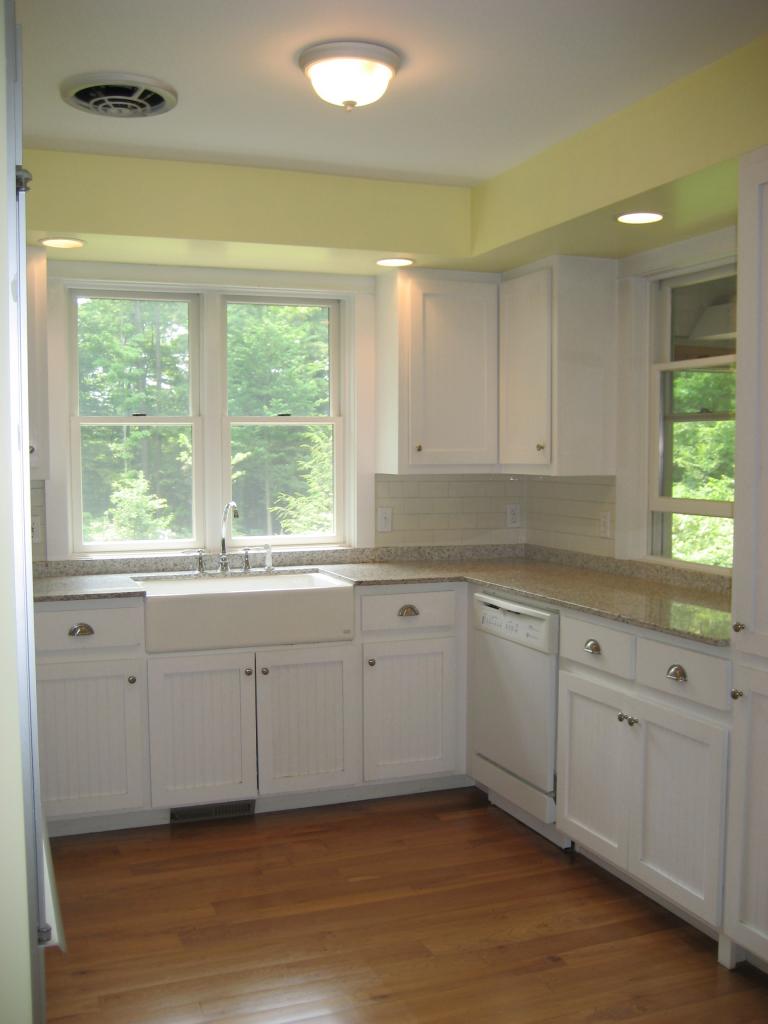 1190 West Center Road Otis, MA 01253 - Photo 2 of 9 a kitchen with granite countertop white cabinets window and a sink