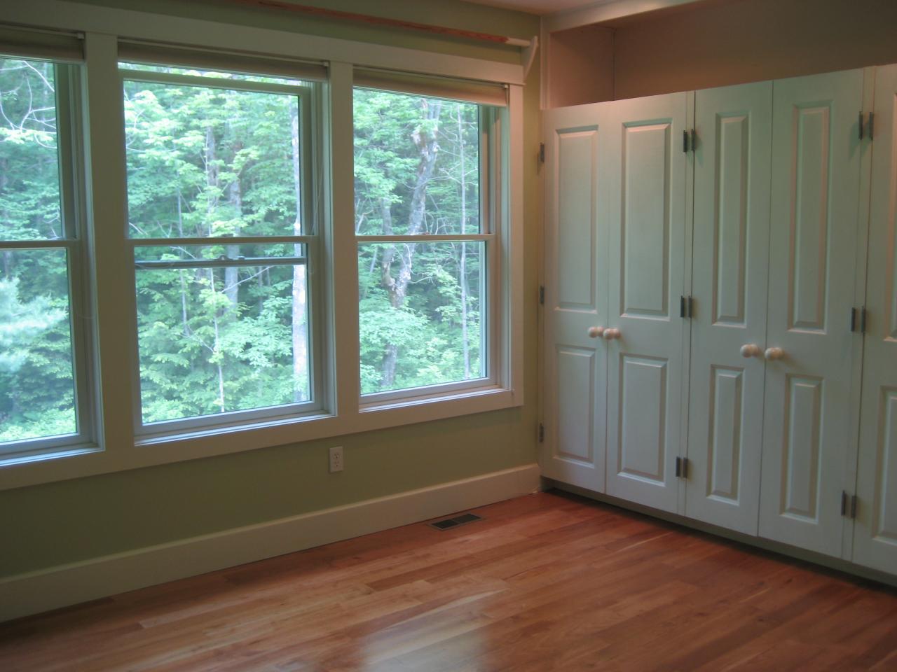 1190 West Center Road Otis, MA 01253 - Photo 5 of 9 a view of an empty room with wooden floor and a window