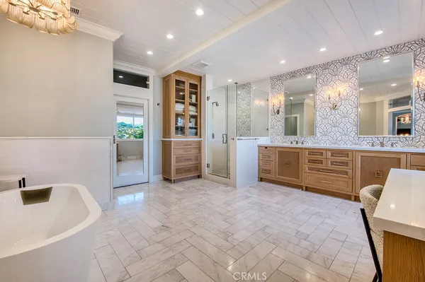 a large kitchen with stainless steel appliances kitchen island granite countertop a sink and cabinets