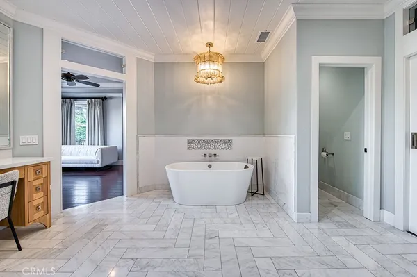 a bathroom with a bathtub and a sink