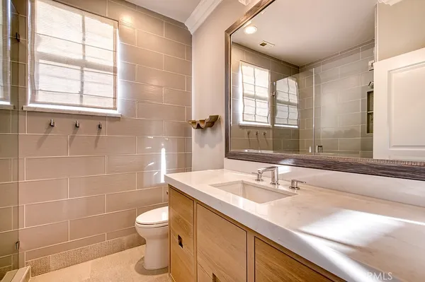 a view of swimming pool with outdoor seating and plants